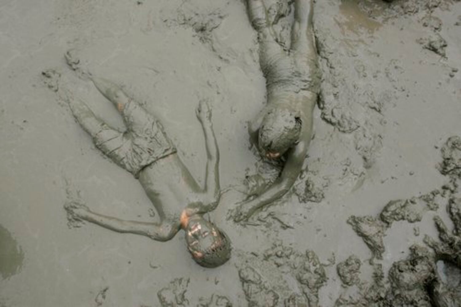 Dream day: Kids frolick in muddy goo