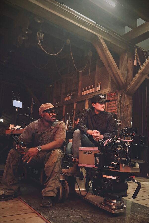 This image released by Warner Bros. Pictures shows director-writer-producer Ryan Coogler, left, and cinematographer Autumn Durald Arkapaw on the set of "Sinners." (Eli Adé/Warner Bros. Pictures via AP)