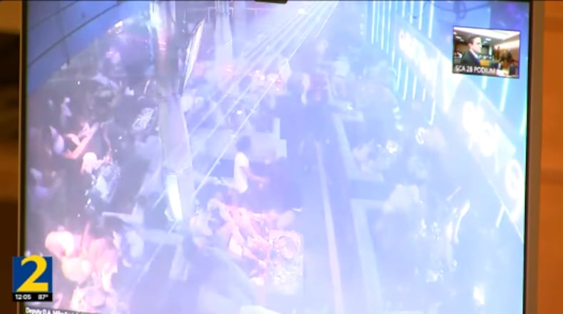 Security footage from inside the Elleven45 Lounge shows the moment a suspect opened fire, killing two people and injuring four others May 12.