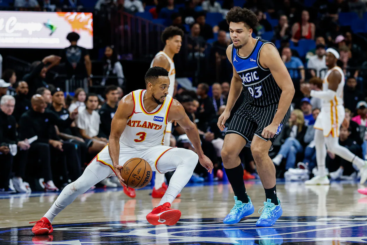 Atlanta Hawks guard CJ McCollum is guarded by Orlando Magic forward Noah Penda during the second half Wednesday, April 1, 2026, in Orlando, Fla. (Kevin Kolczynski/AP)