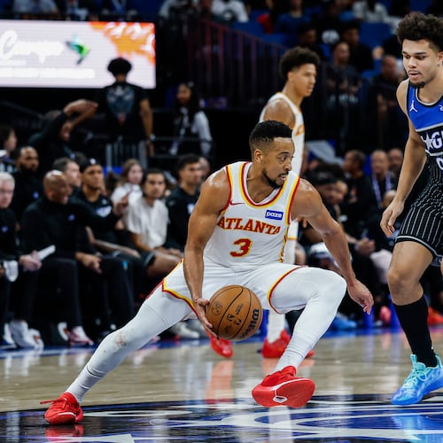 Atlanta Hawks guard CJ McCollum is guarded by Orlando Magic forward Noah Penda during the second half Wednesday, April 1, 2026, in Orlando, Fla. (Kevin Kolczynski/AP)