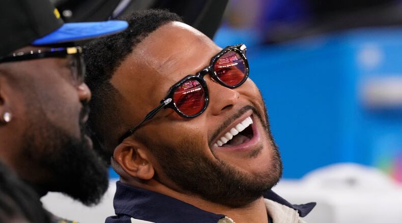 FILE - Former Los Angeles Rams player Aaron Donald looks on before an NFL football game between the Los Angeles Rams and the Tampa Bay Buccaneers, Nov. 23, 2025, in Inglewood, Calif. (AP Photo/Mark J. Terrill, File)