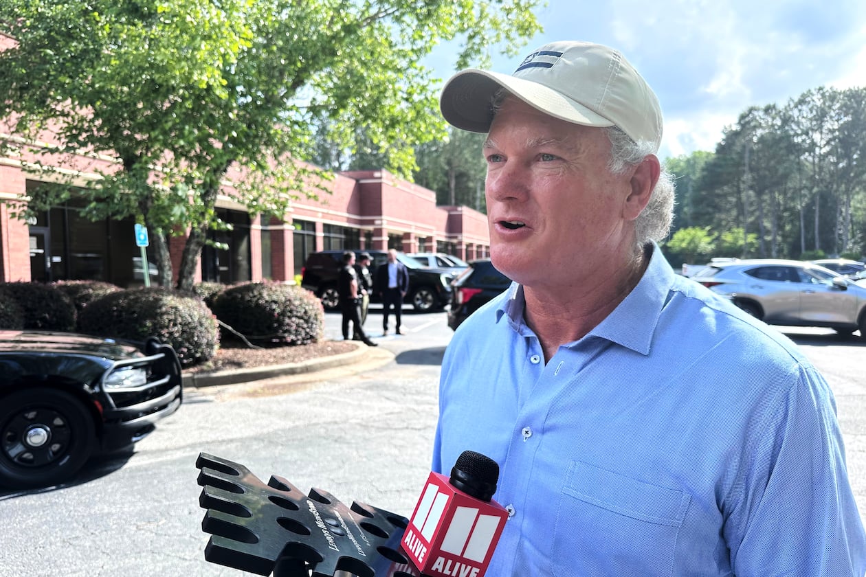 U.S. Rep Mike Collins campaigns in Woodstock, Ga., Sunday, June 14, 2026. ( AP Photo/Bill Barrow)