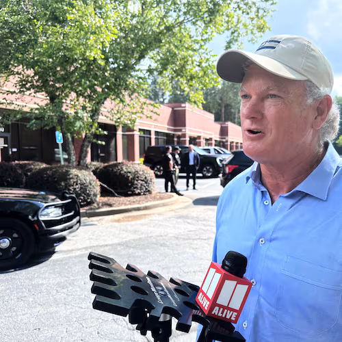 U.S. Rep Mike Collins campaigns in Woodstock, Ga., Sunday, June 14, 2026. ( AP Photo/Bill Barrow)