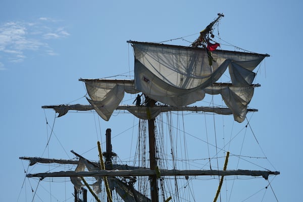 People work the Cuauhtemoc, a masted Mexican Navy training ship, after it collided with the Brooklyn Bridge in New York, Monday, May 19, 2025. (AP Photo/Seth Wenig)