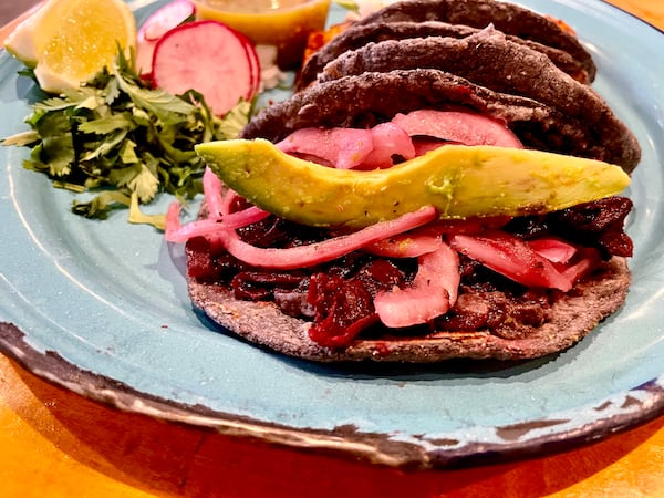 The Hibiscus/Jamaica tacos at Antiguo Lobo can be ordered as a plate with rice and charro beans or by themselves. (Angela Hansberger for the AJC)