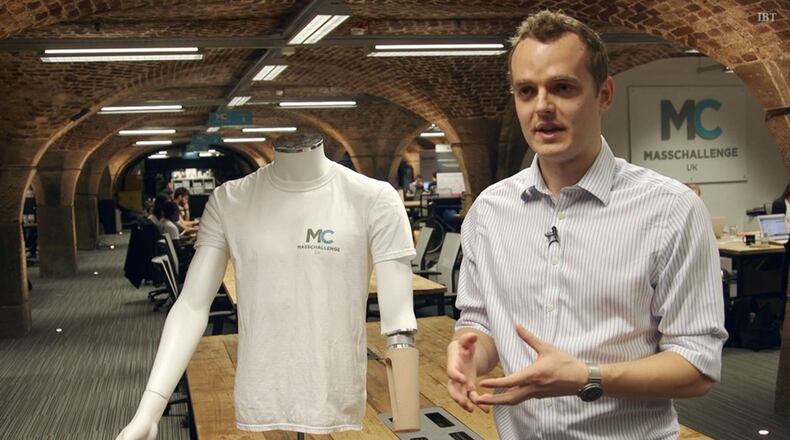 Oliver Armitage, co-founder and director of Cambridge Bio-Augmentation Systems, standing beside a mannequin sporting the Cambridge Bio connector that the startup says will revolutionize the way amputees wear prosthetic limbs. (Cambridge Bio-Augmentation Systems)