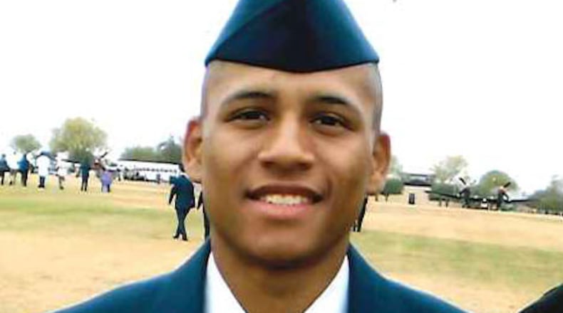 Anthony Hill, center, and his parents: Anthony Hill Sr. and Carolyn Baylor-Giumm.