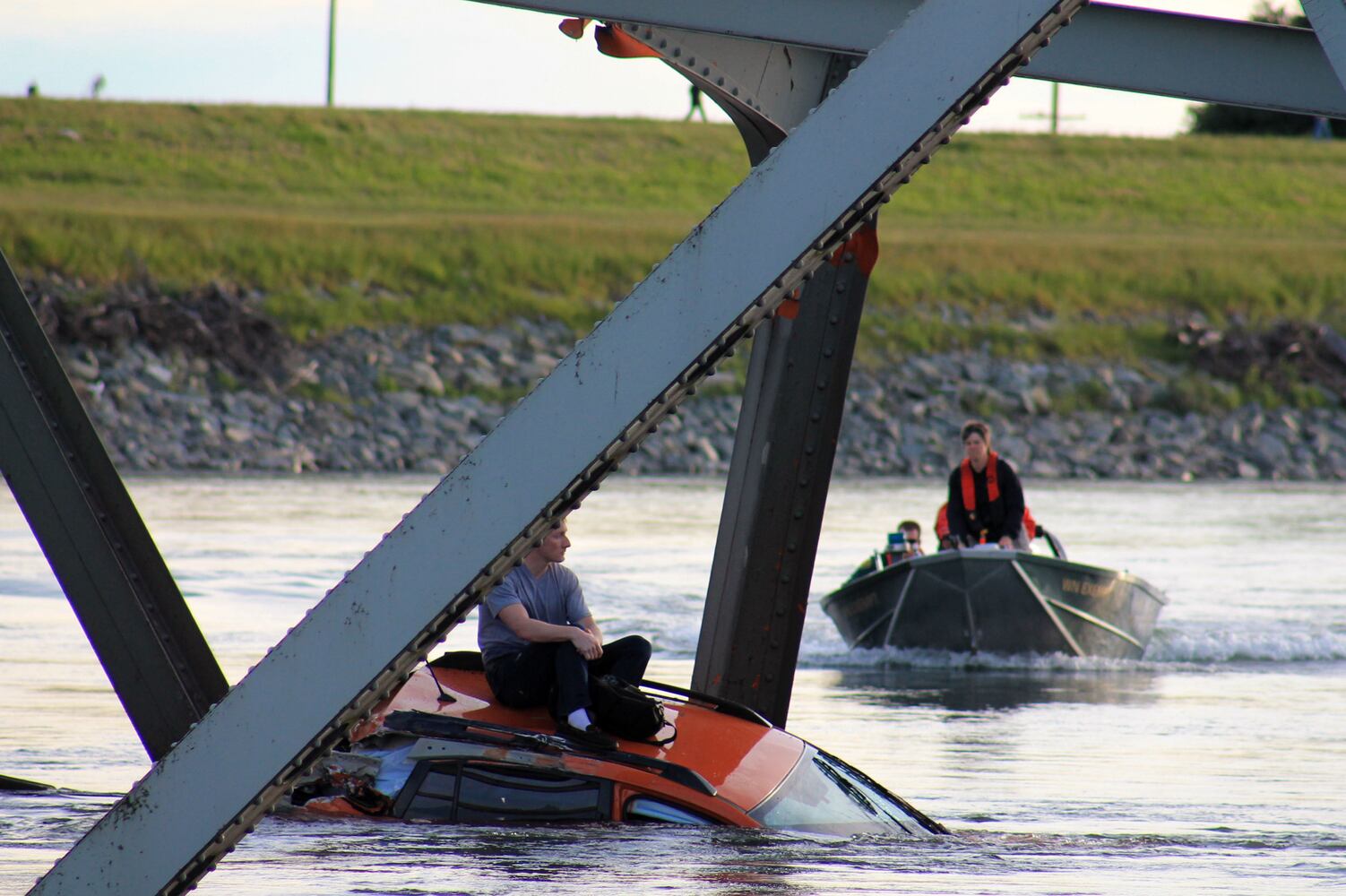 Vehicles, people dumped into water
