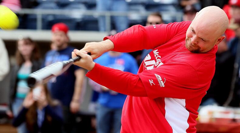 Brian McCann swings for the fences during the Home Run Challenge, part of the fifth annual Brian McCann Rally Foundation Celerity Softball Game at Coolray field in Lawrenceville on Nov. 9, 2013. Bert's Big Bats team played against Tug's Triple Threat in the event that raised funds for childhood cancer research. PHIL SKINNER / AJC file photo