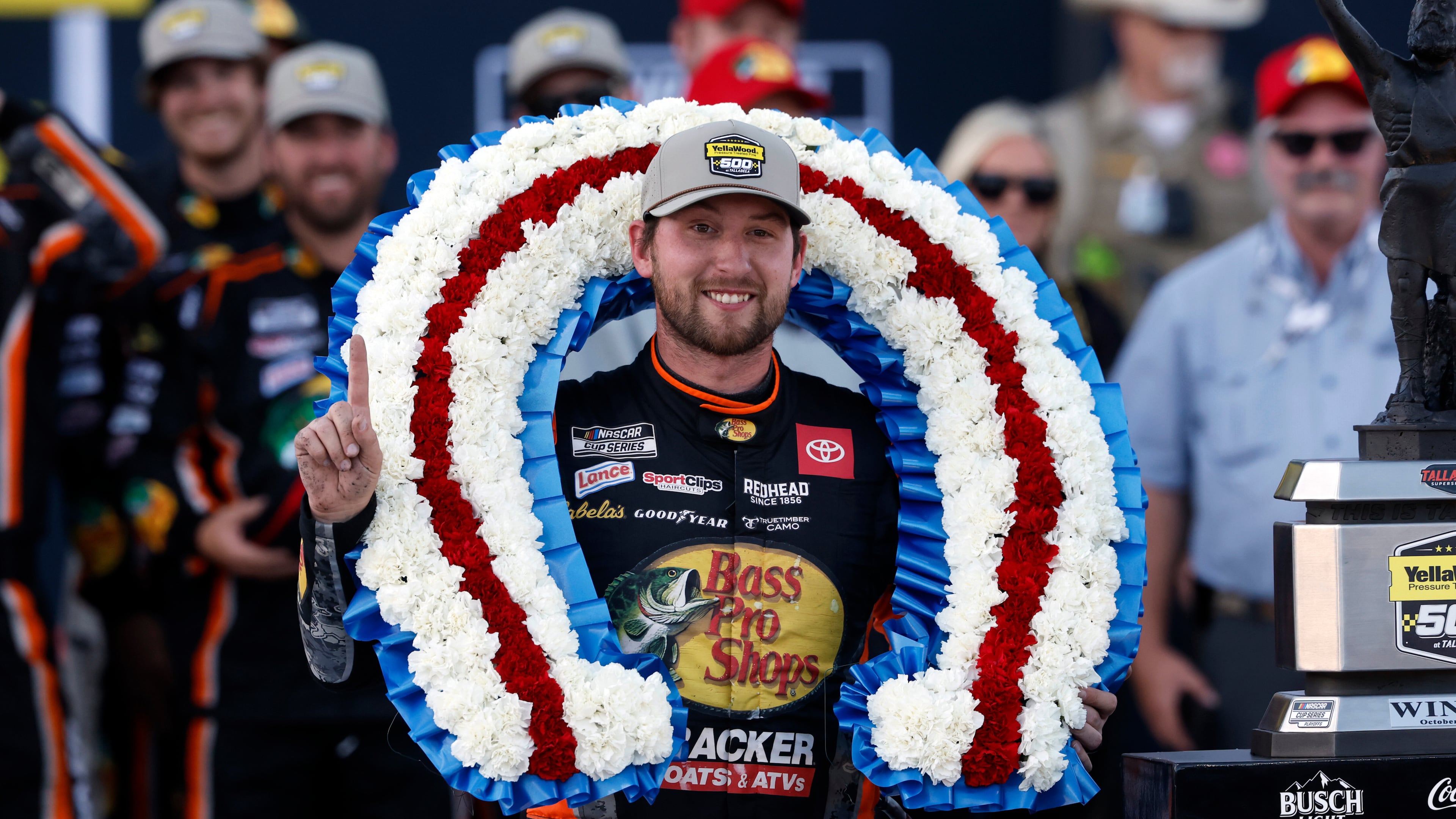 Driver Chase Briscoe celebrates with a victory wreath after winning a NASCAR Cup Series auto race at Talladega Superspeedway, Sunday, Oct. 19, 2025, in Talladega, Ala. (AP Photo/Butch Dill)