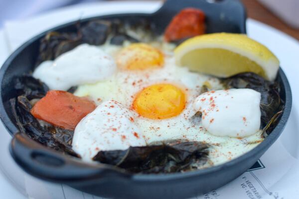 Green shakshuka at Mediterranea features eggs baked onto a savory bed of collard greens. CONTRIBUTED BY HENRI HOLLIS