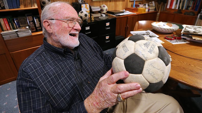The autographs are a  little faded now on the 1968 Atlanta Chiefs soccer ball prized by the team's vice president at the time, Dick Cecil. (Curtis Compton/AJC file)