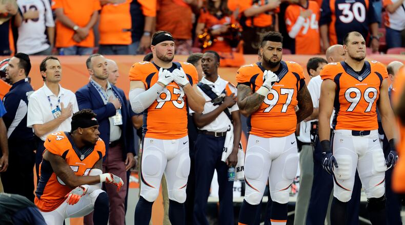 Denver Broncos inside linebacker Brandon Marshall (54) kneels during the National Anthem prior to an NFL football game against the Carolina Panthers, Thursday, Sept. 8, 2016, in Denver. (AP Photo/Joe Mahoney)