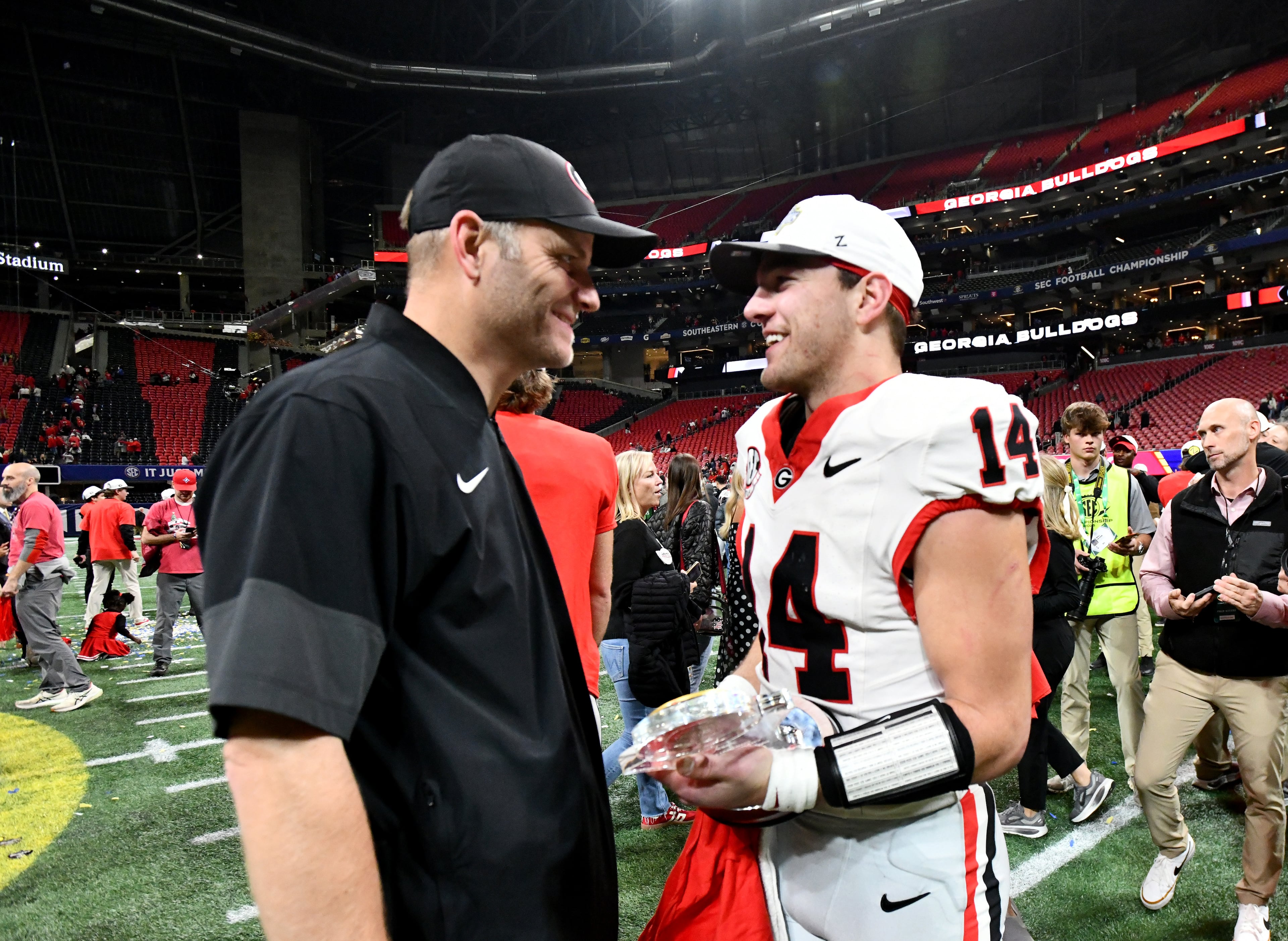 Georgia quarterback Gunner Stockton (14) celebrate after defeating Alabama 28-7 in the SEC Championship football game at the Mercedes-Benz Stadium, Saturday, December 6, 2025 in Atlanta. (Hyosub Shin / AJC)