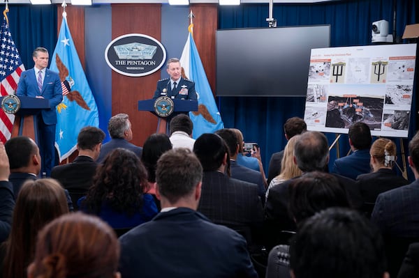 Joint Chiefs Chairman Gen. Dan Caine, right, speaks during a news conference with Defense Secretary Pete Hegseth at the Pentagon, Thursday, June 26, 2025 in Washington. (AP Photo/Kevin Wolf)