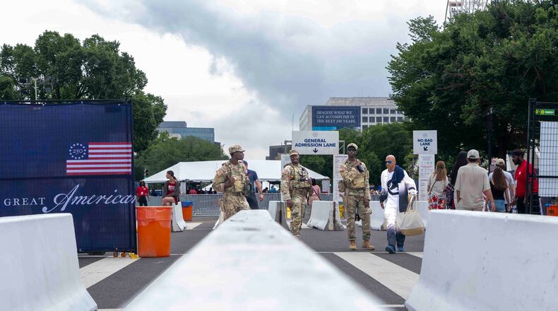 National Guard members stand at the entrance of the Great American State Fair on the National Mall, Saturday June 27, 2026, in Washington. (AP Photo/Jen Golbeck)