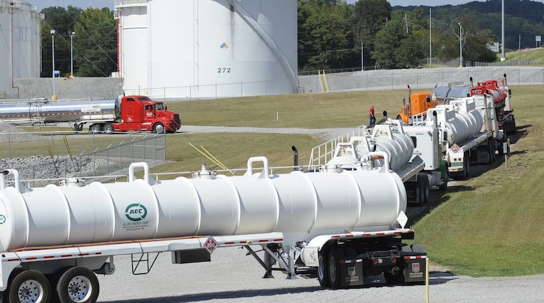 Tanker trucks line up at a Colonial Pipeline facility in Pelham, Ala. The Alpharetta company’s 5,500-mile network is the nation’s biggest. (AP Photo/Jay Reeves)