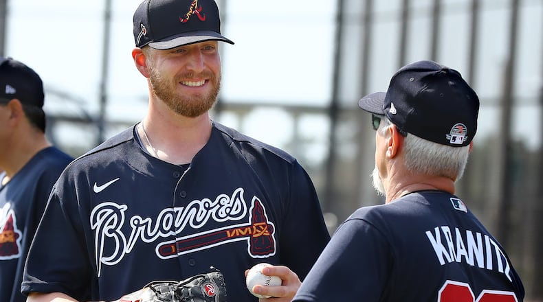 Braves reliever Will Smith, who joined Atlanta this offseason, confers with pitching coach Rick Kranitz during the first workout oft spring Thursday, Feb. 13, 2020, at CoolToday Park in North Port, Fla.