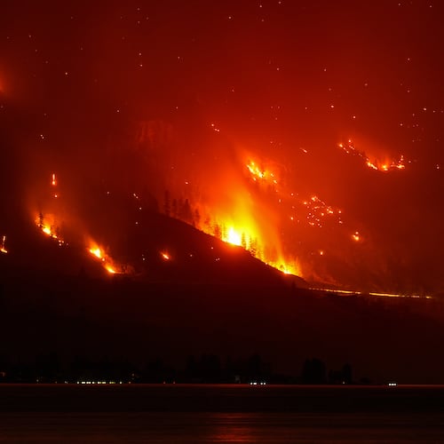 The Bald Range wildfire, that has forced people out of their homes in the south Okanagan region, burns in Summerland, B.C., late Saturday, Aug. 8, 2026. (Darryl Dyck/The Canadian Press via AP)