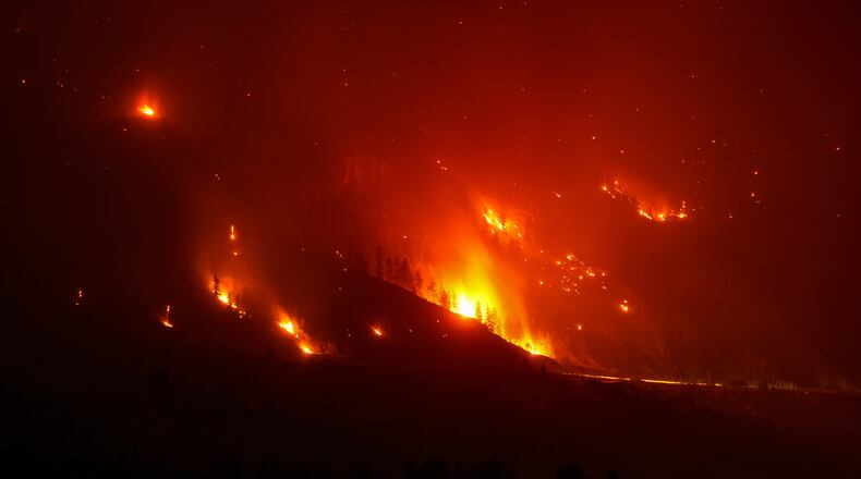 The Bald Range wildfire, that has forced people out of their homes in the south Okanagan region, burns in Summerland, B.C., late Saturday, Aug. 8, 2026. (Darryl Dyck/The Canadian Press via AP)