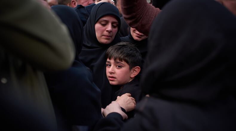 Mohammed, 8, cries next to the coffin of his father, Hussein Makkah, during the funeral of 13 state security officers killed the previous day in an Israeli strike in Lebanon’s coastal city of Sidon, Lebanon, Saturday, April 11, 2026. (AP Photo/Emilio Morenatti)