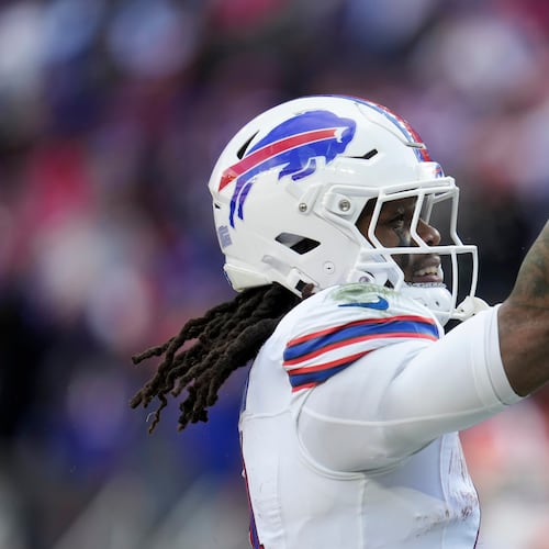 Buffalo Bills running back James Cook III celebrates his touchdown against the Cleveland Browns during the first half of an NFL football game in Cleveland, Sunday, Dec. 21, 2025. (AP Photo/Sue Ogrocki)