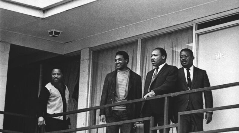 Rev. Martin Luther King Jr. stands with other civil rights leaders on the balcony of the Lorraine Motel in Memphis