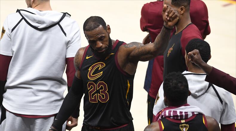 LeBron James reacts as he exits the game in the fourth quarter against the Golden State Warriors during Game Four of the 2018 NBA Finals at Quicken Loans Arena on June 8, 2018 in Cleveland.