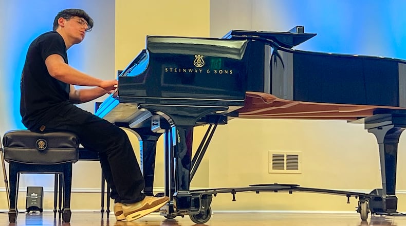 Elias Kremer wants researchers to examine the potential benefits of music to people with brain diseases. He performs free concerts at senior living centers, nursing homes and community centers. He was inspired by his grandmother, who has Parkinson's disease. (Courtesy of Elias Kremer)