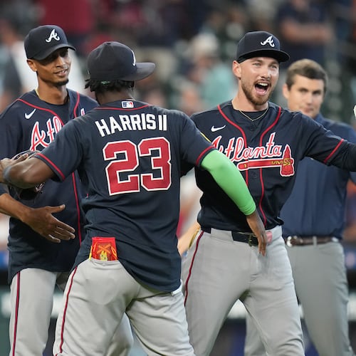 Atlanta Braves' Michael Harris II (23) and DaShawn Keirsey Jr., front right, celebrate on the field after a baseball game against the Houston Astros as they clinched the NL East title, Sunday, Sept. 20, 2026, in Houston. (AP Photo/Karen Warren)