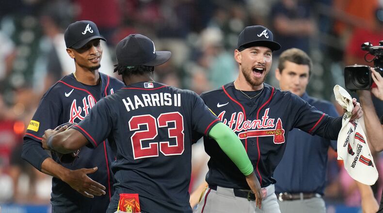 Atlanta Braves' Michael Harris II (23) and DaShawn Keirsey Jr., front right, celebrate on the field after a baseball game against the Houston Astros as they clinched the NL East title, Sunday, Sept. 20, 2026, in Houston. (AP Photo/Karen Warren)
