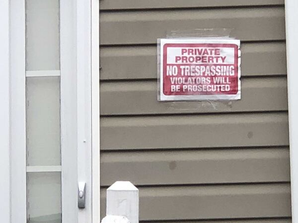 A sign hangs outside the Locust Grove home of Tierre Guthrie. Photo Leon Stafford/AJC