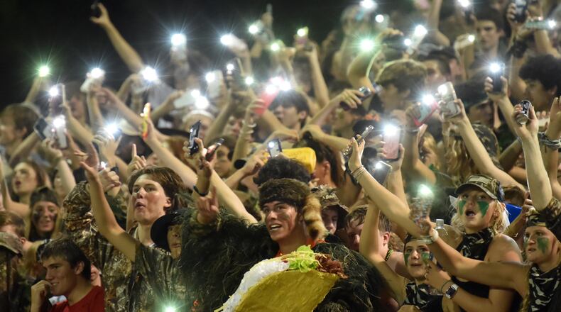 August 27, 2021 Roswell - Marist fans cheer for their team in the second half at Blessed Trinity Catholic High School in Roswell on Friday, August 27, 2021. Marist won 28-13 over Blessed Trinity. (Hyosub Shin / Hyosub.Shin@ajc.com)