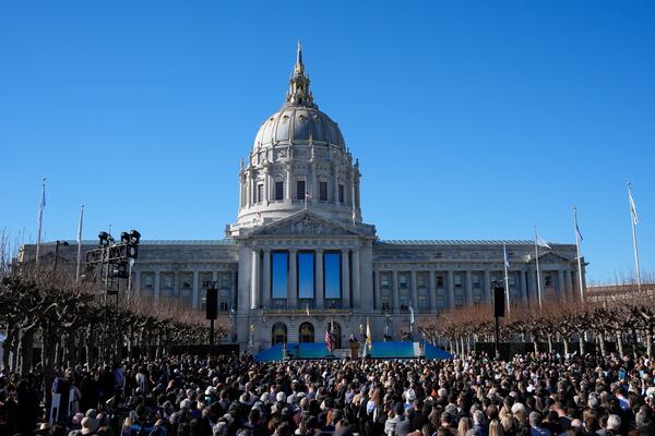 FILE - The crowd watches as Mayor Daniel Lurie, center, delivers his inaugural address outside City Hall, Wednesday, Jan. 8, 2025, in San Francisco. (AP Photo/Godofredo A. Vásquez, File)