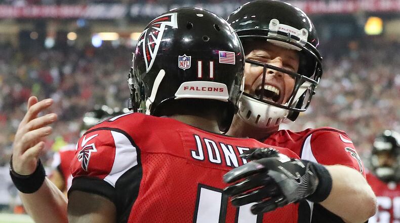 Matt Ryan celebrates with Julio Jones during the NFC Championship game Sunday, Jan. 22, 2017, in Atlanta.