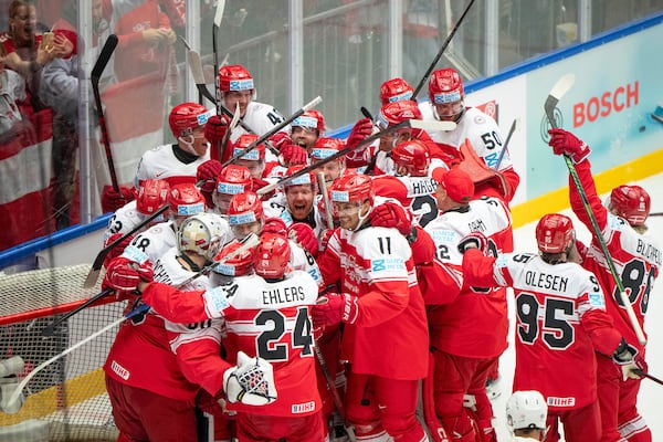 Denmark players celebrate after their 2-1 win in a quarterfinal game between Canada and Denmark at the hockey world championships, Thursday, May 22, 2025, in Herning, Denmark. (Bo Amstrup/Ritzau Scanpix via AP)