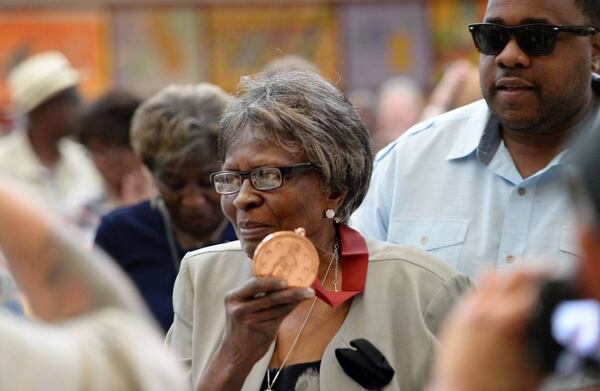 Mama Louise Hudson, original founder of H&H restaurant with her late cousin Inez Hill died Tuesday at the age of 93. File Photo. Louise Hudson displays the Tubman African American Museum Act of Courage Award she received for her years of service to the community. “Mama Louise” as she is better known, opened the H&H Restaurant downtown in 1952 with her cousin, Inez Hill, and “nourished a community” that included more than a few rock stars.