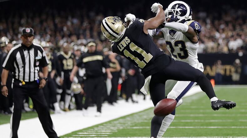 New Orleans Saints wide receiver Tommylee Lewis (11) works for a coach against Los Angeles Rams defensive back Nickell Robey-Coleman (23) during the second half the NFL football NFC championship game Sunday, Jan. 20, 2019, in New Orleans. The Rams won 26-23. (AP Photo/Gerald Herbert)