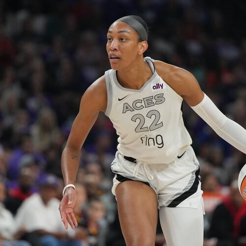 FILE - Las Vegas Aces center A'ja Wilson (22) dribbles against the Phoenix Mercury during the first half of Game 4 of the WNBA basketball finals, Friday, Oct. 10, 2025, in Phoenix. (AP Photo/Rick Scuteri, File)