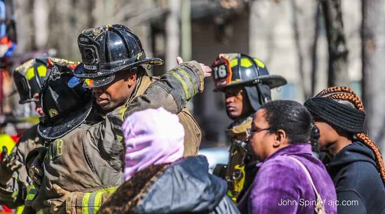 Heavy smoke and flames had taken over the roof of three units at the community on Maypop Lane in Decatur by the time firefighters arrived.