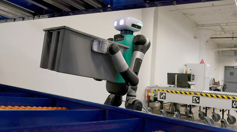 FILE - Agility Robotics' warehouse robot Digit performs maneuvers at the company's office in Pittsburgh on Aug. 16, 2023. (AP Photo/Matt Freed, File)