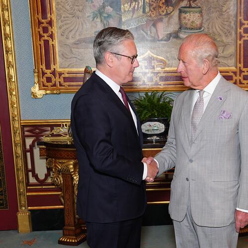 Britain's King Charles III welcomes outgoing Prime Minister Keir Starmer, during an audience at Buckingham Palace in London, Monday July 20, 2026. (Aaron Chown/Pool Photo via AP)