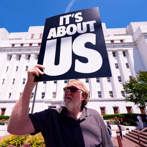 Randall Williams protests outside the Alabama state house during a special session of the Alabama Legislature, Monday, May 4, 2026, in Montgomery, Fla. (AP Photo/Mike Stewart)