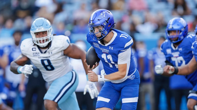 Georgia State's Christian Veilleux (11) runs with the ball during the second half of an NCAA football game against Old Dominion on Saturday, Oct.12 , 2024 in Atlanta. (AP Photo/Stew Milne)