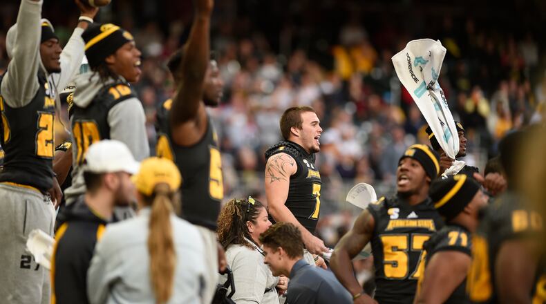 Kennesaw State University football players cheer on the bench at the game against Jacksonville State at SunTrust Park, Saturday, Nov. 17, 2018, in Atlanta. (Annie Rice/AJC)
