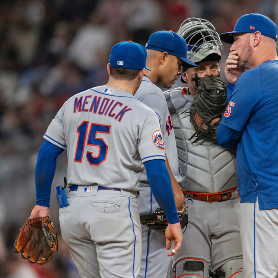 Mets pitching coach Jeremy Hefner (right) meets on the mound with catcher Francisco Alvarez (center right), shortstop Danny Mendick (left) and pitcher Jose Quintana during an August game against the Braves in Atlanta. (Hakim Wright Sr./AP 2025)