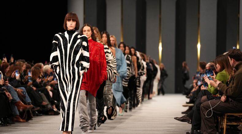 FILE - Models wear creations as part of the Balmain Fall/Winter 2025-2026 Womenswear collection presented in Paris, March 5, 2025. (Photo by Scott A Garfitt/Invision/AP, File)