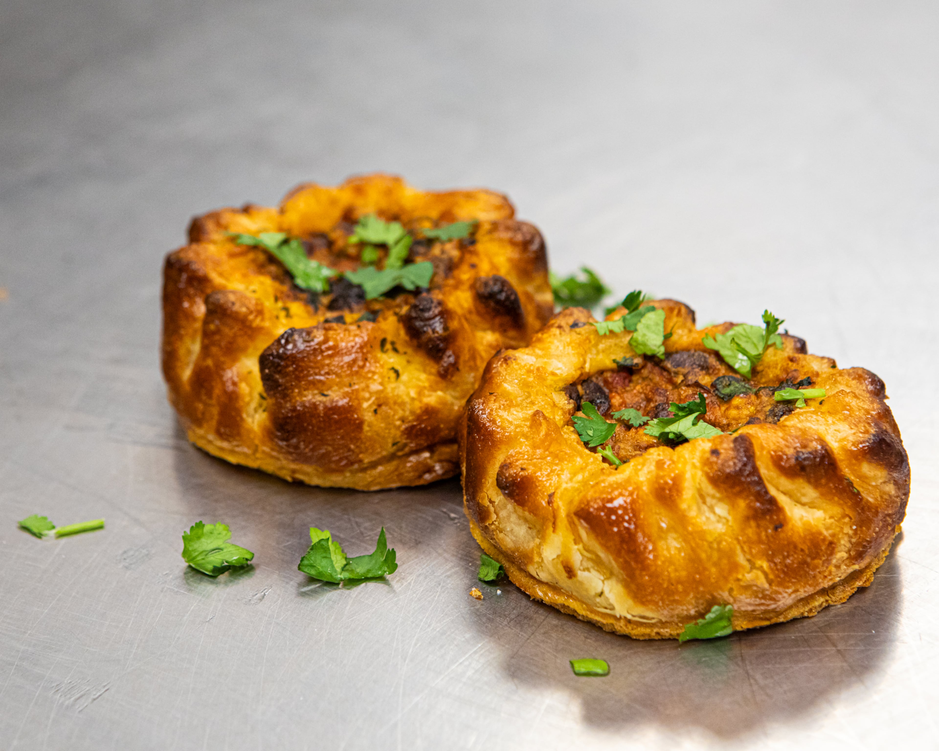 Rose Gates's savory galettes are made with a versatile puff pastry and summer produce seasoned with Southwest flavors. (Aaliyah Man for the AJC)