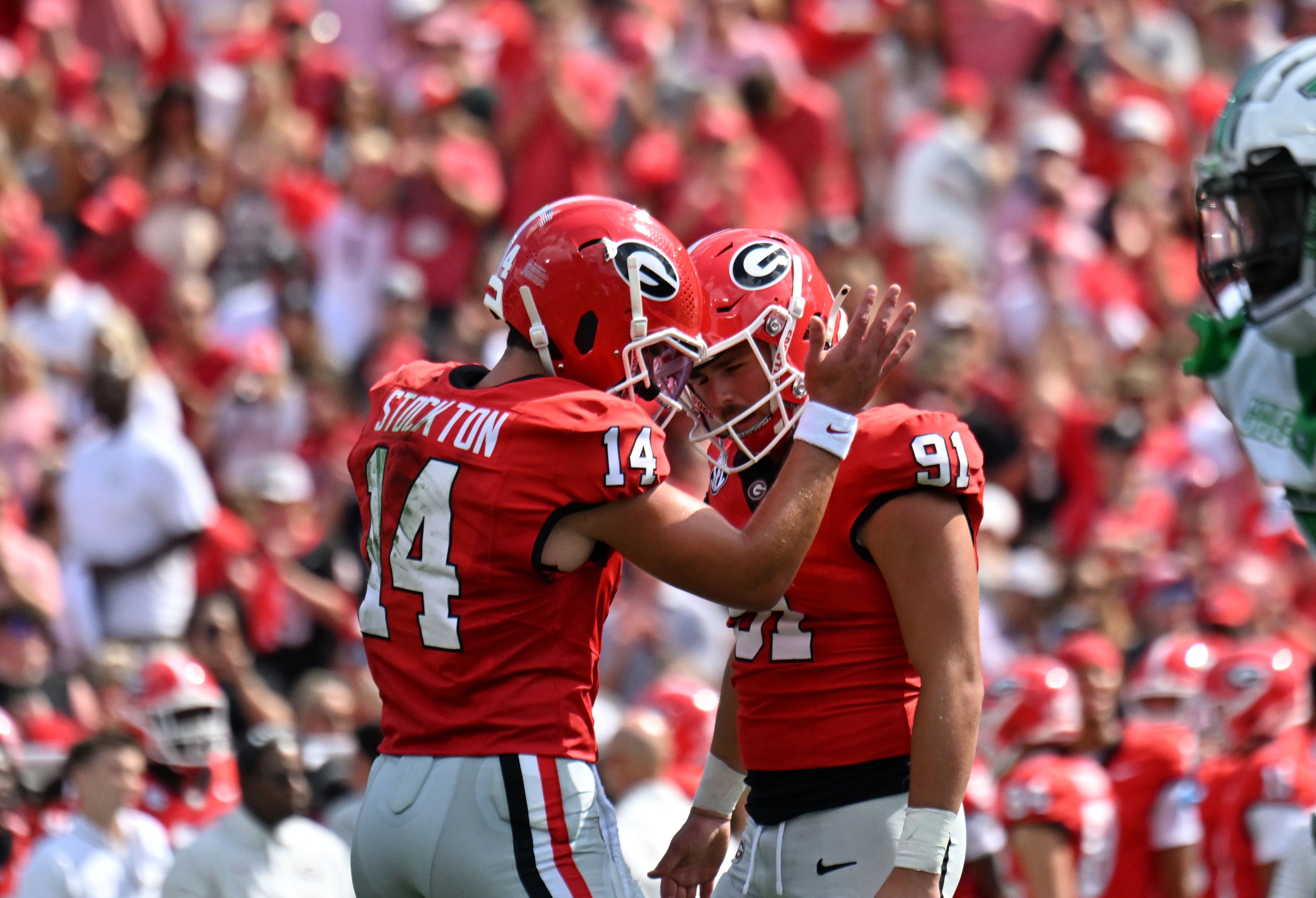 Georgia quarterback Gunner Stockton (14) celebrates with Georgia place kicker Peyton Woodring (91) after the field goal during the first half in an NCAA football game at Sanford Stadium, Saturday, August 30, 2025, in Athens. (Hyosub Shin / AJC)
